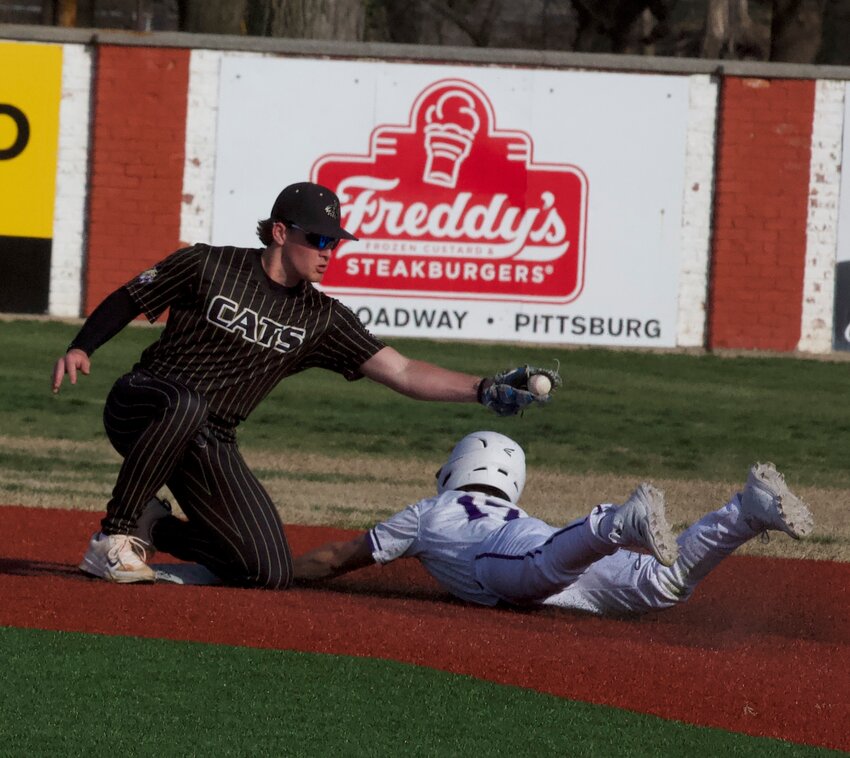 Pittsburg senior Alex Johnston steals second in the third inning Tuesday against Neosho, Mo. BROCK SISNEY / THE MORNING SUN