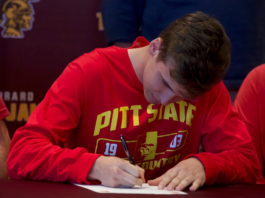 Girard senior Houston McGown signed Wednesday afternoon with Pittsburg State, surrounded by friends, family, coaches and administration. BROCK SISNEY / THE MORNING SUN