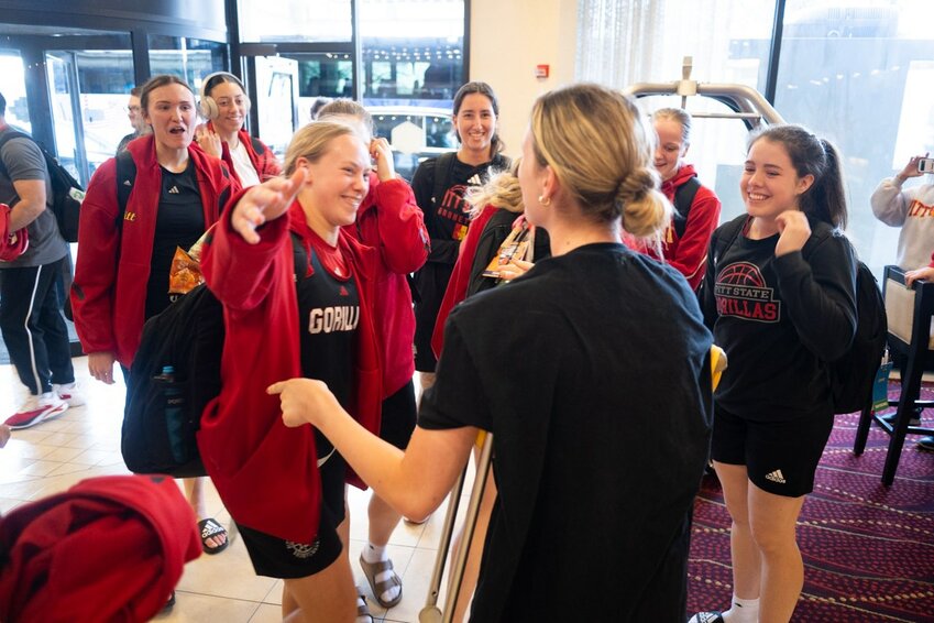 Pittsburg State's basketball players were all smiles when they were greeted by injured teammate Macie Mays on Wednesday afternoon in the hotel lobby in Pittsburgh, Pa.