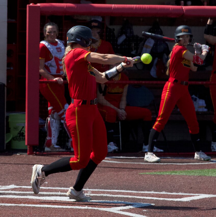 Pittsburg State junior shortstop Heather Arnett connects with the go-ahead two-run double in the first game of a MIAA doubleheader Monday afternoon against Northwest Missouri. BROCK SISNEY / THE MORNING SUN