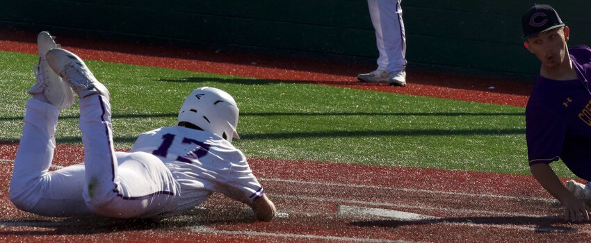 Pittsburg senior Alex Johnston slides home safely for an 11-1 lead Tuesday against Coffeyville at Jaycee Ballpark. BROCK SISNEY / THE MORNING SUN