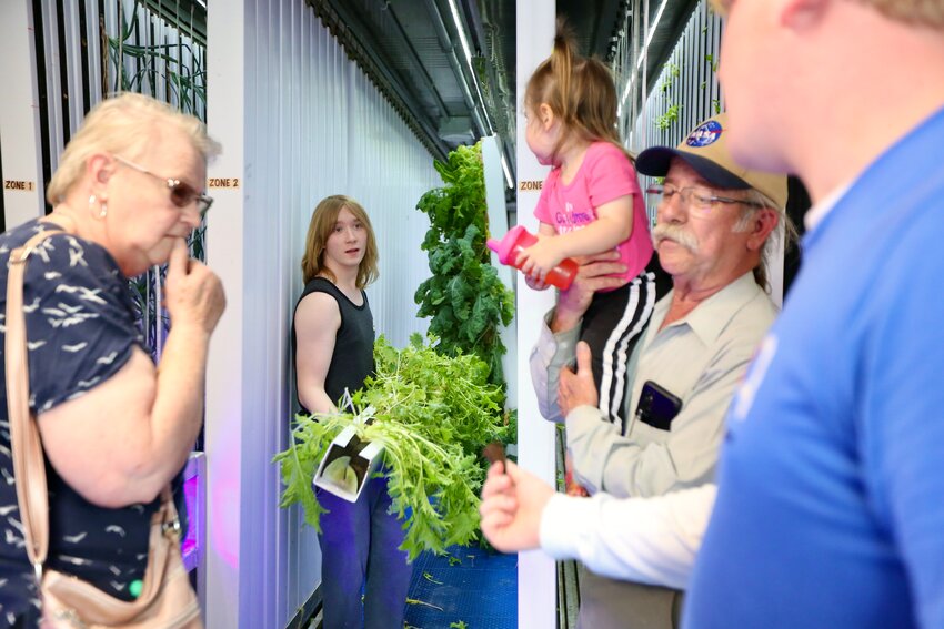 Students at Pittsburg High School hosted public tours of Dragon Farms Thursday evening, answering questions and providing information regarding the hydroponic farm, which offers several advantages over traditional soil-based agriculture.