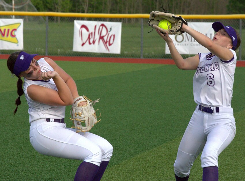 Pittsburg senior Haley Gray makes a running catch in right field after calling off second baseman Heather Mowdy during the second game of a doubleheader sweep Wednesday against Blue Valley West. BROCK SISNEY / THE MORNING SUN