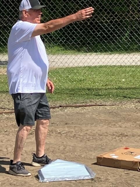 Mulberry Mayor Pat Walden directs city workers at the newly refurbished baseball diamond in preparation for Mulberry&rsquo;s Homecoming on May 23. Orange &amp; Black Night begins at 5 p.m. and will feature a cake walk, bounce house, car show, games, food vendors, and live music provided by The Little Green Men.