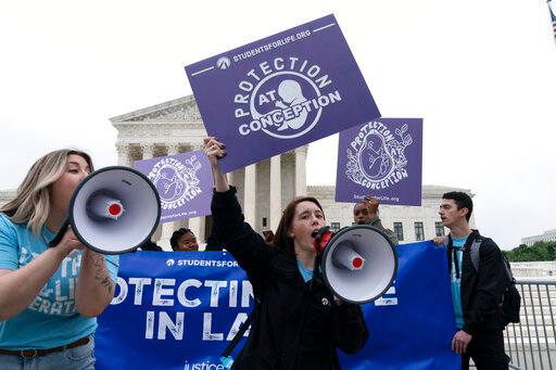 Demonstrators protest outside of the U.S. Supreme Court Tuesday, May 3, 2022 in Washington. A draft opinion suggests the U.S. Supreme Court could be poised to overturn the landmark 1973 Roe v. Wade case that legalized abortion nationwide, according to a Politico report released Monday. Whatever the outcome, the Politico report represents an extremely rare breach of the court's secretive deliberation process, and on a case of surpassing importance. (AP Photo/Jose Luis Magana)