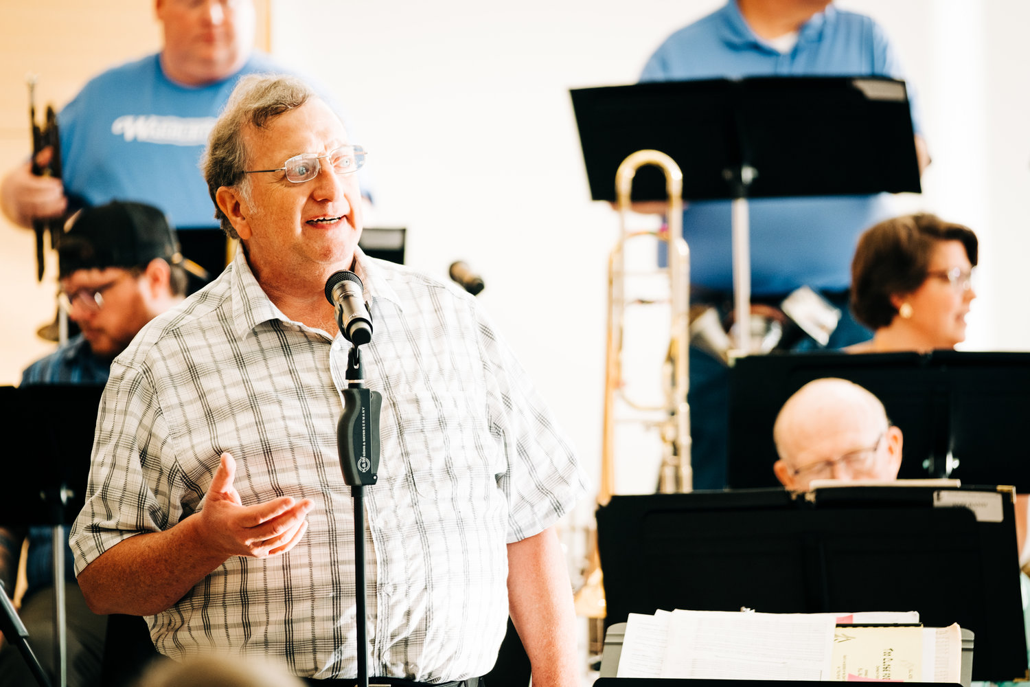 Professor Robert Kehle introduces the band during the Festival of the Arts: Summer Kicks Jazz Concert at the Bicknell Family Center for the Arts on Monday.