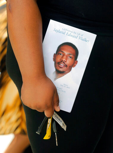 A person leaves the funeral of Jayland Walker at the Akron Civic Theatre on Wednesday, July 13, 2022 in Akron, Ohio. (Phil Masturzo/Akron Beacon Journal via AP)