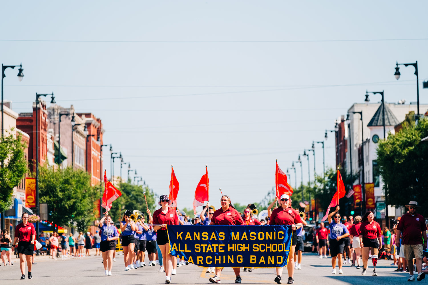 The Kansas Masonic Marching Band participates in the Shrine Bowl parade, marching down Broadway in Pittsburg on Saturday.
