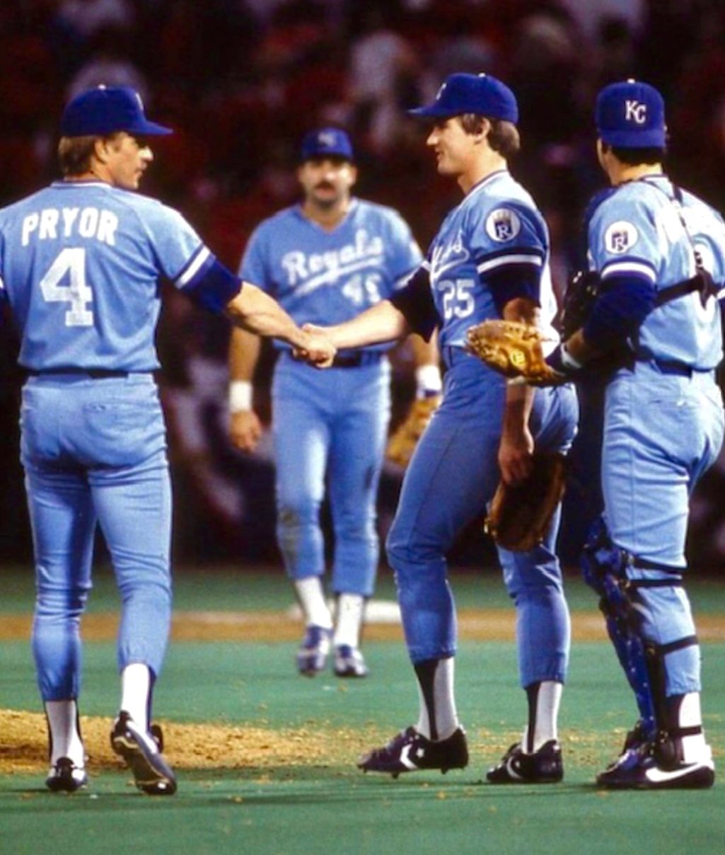 Former Royals second baseman Greg Pryor shakes hands with pitcher Danny Jackson at the end of Game five of the 1985 World Series in St. Louis. 
Jim Sundberg is the catcher and Royals first baseman Steve Balboni is walking towards the mound.