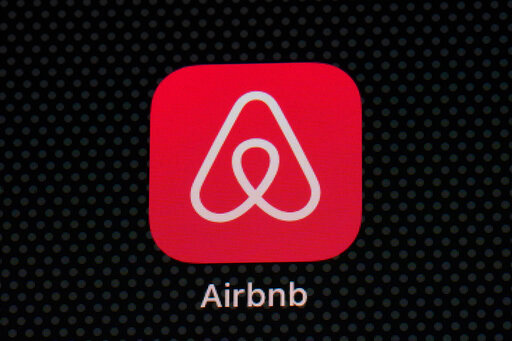 FILE - The Airbnb app icon is displayed on an iPad screen in Washington, D.C., on May 8, 2021. Airbnb announced Tuesday, Aug. 16, 2022, that it will use new methods to spot and block people who try to use the short-term rental service to throw a party. The company said it has introduced technology that examines the would-be renter's history on Airbnb, how far they live from the home they want to rent, whether they're renting for a weekday or weekend, and other factors. (AP Photo/Patrick Semansky, File)