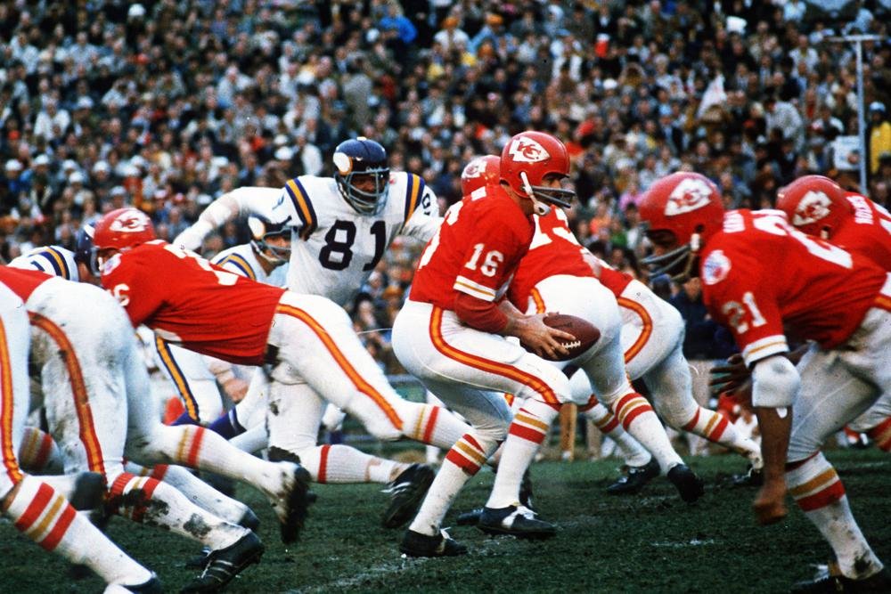 Kansas City Chiefs quarterback Len Dawson (16) turns around to hand the ball off to running back Mike Garrett (21) during the Super Bowl IV football game in New Orleans., Jan. 11, 1970. Hall of Fame quarterback Len Dawson, who helped the Kansas City Chiefs to a Super Bowl title, died Wednesday, Aug. 24, 2022. He was 87.