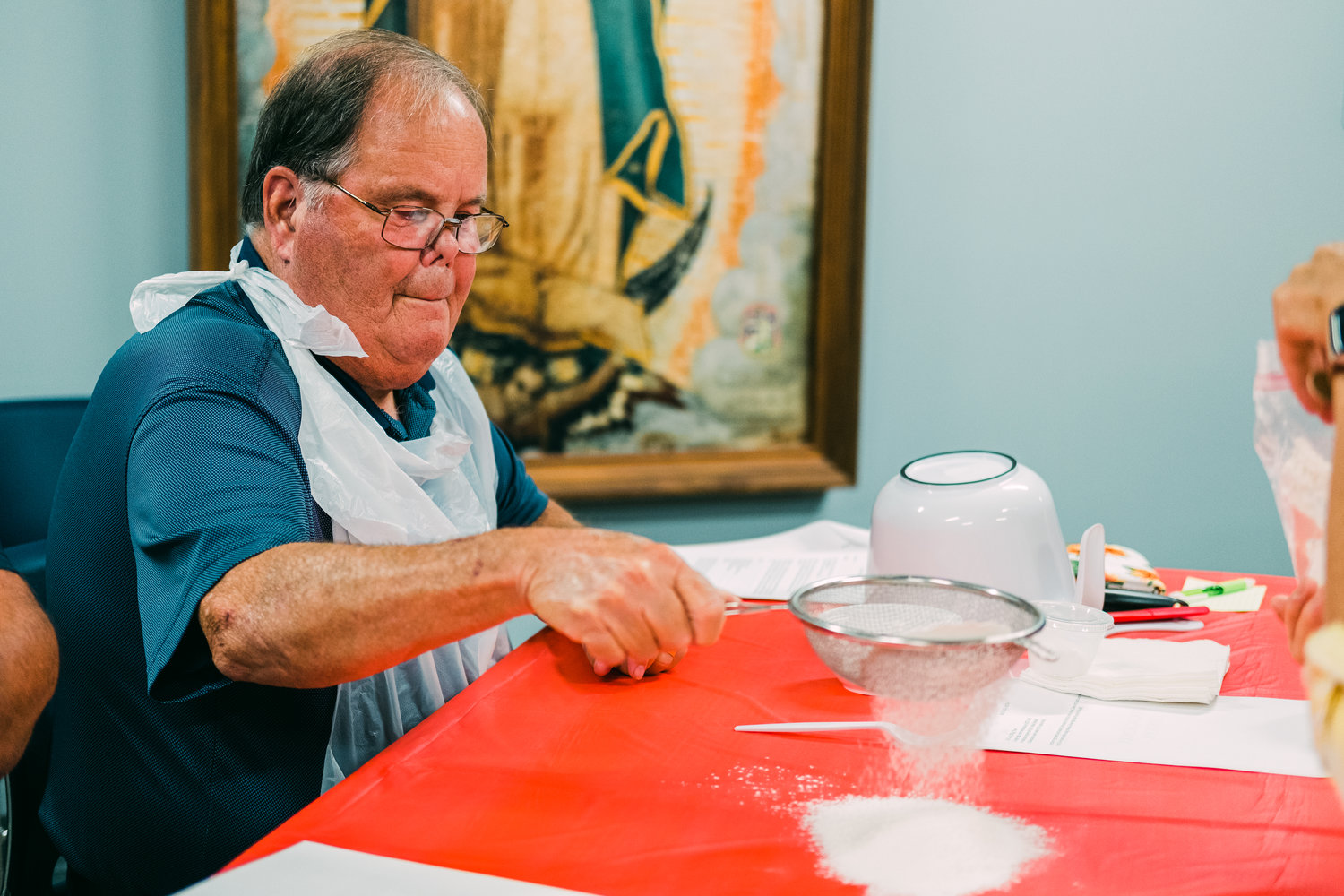 Steve Hicks sifts flour for the pasta dough lesson during the Little Balkans Cooking School on Monday at St. Mary’s Guadalupe Hall. Each recipe included a wine or beer pairing.