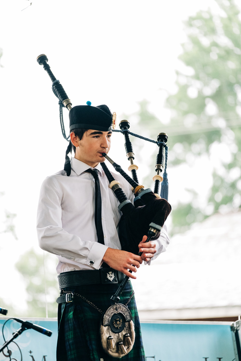 Orin Weiss plays the bag pipes during the Folklife Festival on the Astra Stage in Lincoln Park as part of the Little Balkans Days Celebration on Saturday.