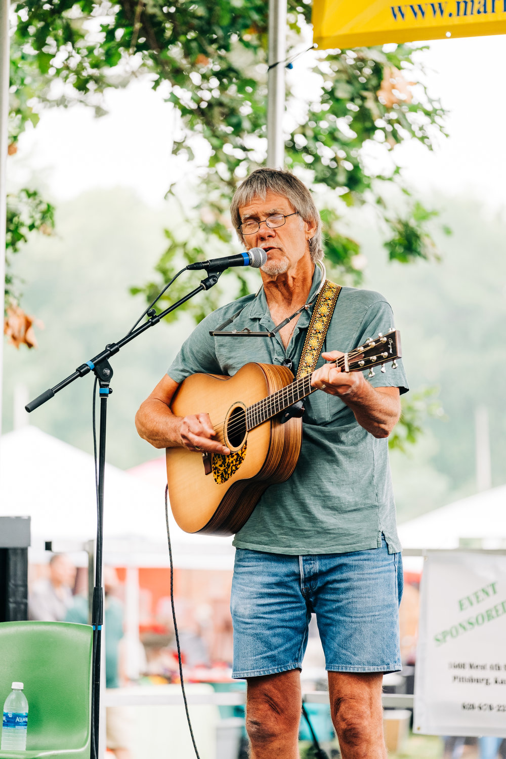 Joey Pogue performs during the Folklife Festival on the Astra Stage in Lincoln Park on Saturday.