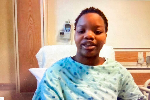 FILE - In this image taken from a video screen, Tafara Williams speaks to reporters from her hospital bed during a Zoom meeting Tuesday, Oct. 27, 2020, in Libertyville, Ill. A suburban Chicago police officer who shot a Black couple inside a vehicle — killing a 19-year-old man and wounding his girlfriend, Williams — has been charged with second-degree murder and involuntary manslaughter. Court records state Dante Salinas was charged in connection with the Oct. 20, 2020, shooting death of Marcellis Stinnette, 19, of Waukegan. His girlfriend, Williams, was injured. (Zoom via AP Photo, File)