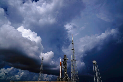 FILE - The NASA moon rocket stands on Pad 39B before a launch attempt for the Artemis 1 mission to orbit the moon at the Kennedy Space Center, Friday, Sept. 2, 2022, in Cape Canaveral, Fla. On Friday, Sept. 23, 2022, a storm in the Caribbean is threatening to delay NASA's third attempt to launch the rocket. (AP Photo/Brynn Anderson, File)