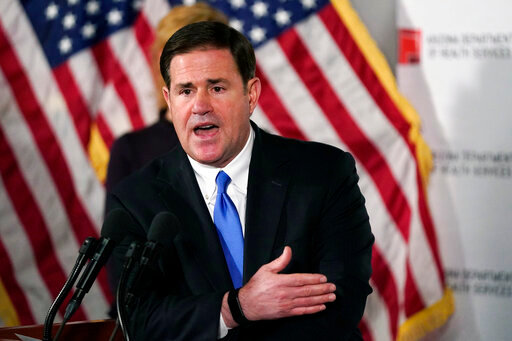 FILE - In this Dec. 2, 2020, file photo, Arizona Republican Gov. Doug Ducey answers a question during a news conference in Phoenix.  A new Arizona law banning abortions after 15 weeks of pregnancy takes effect Saturday, Sept. 24, 2022 as a judge weighs a request to allow a pre-statehood law that outlaws nearly all abortions to be enforced. (AP Photo/Ross D. Franklin, Pool, File)