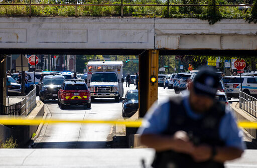 Chicago police respond to a shooting near the CPD Homan Square facility Monday, Sept. 26, 2022.  One person was shot and a Chicago police officer was wounded Monday during an incident inside a police facility on the city's West Side, officials said. (Brian Cassella/Chicago Tribune via AP)