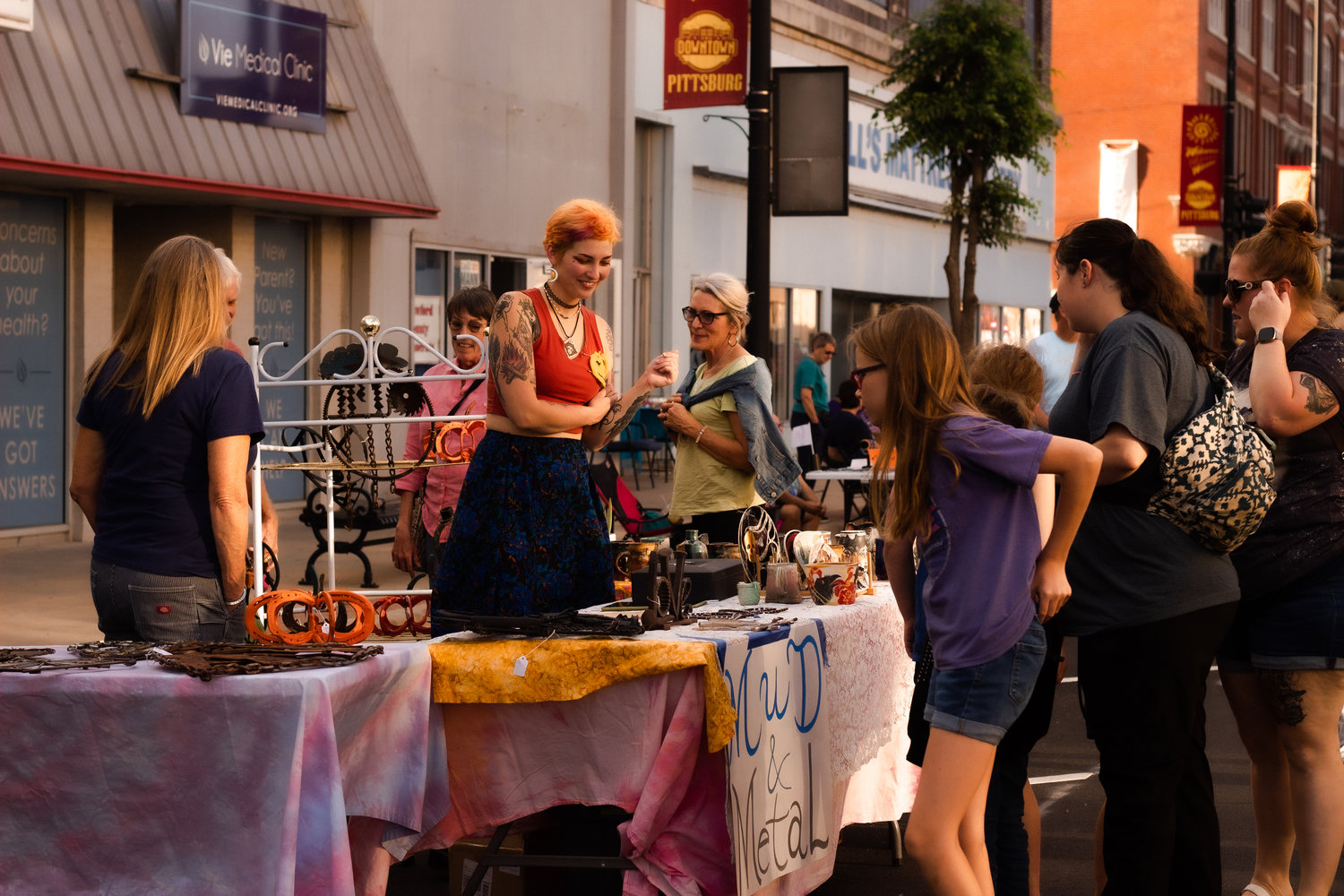 Sylvia Grotheer of Mud & Metal shows her work to ArtWalk attendees on Friday, Sept. 23.