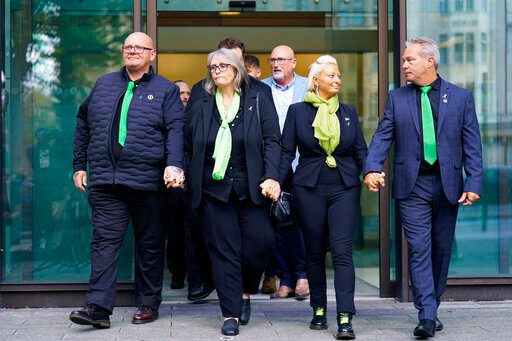 From left, the parents of 19-year-old Harry Dunn, Tim Dunn, father, stepmother Tracey Dunn, Charlotte Charles, mother and stepfather Bruce Charles leave Westminster Magistrates' Court, London, Thursday Sept. 29, 2022, where US citizen Anne Sacoolas, 45, appeared in a British court via videolink. The court granted her unconditional bail and scheduled the next hearing for Oct. 27. Sacoolas has been charged with causing death by dangerous driving in the death of 19-year-old Harry Dunn. He was killed in a collision with a car outside an air base in eastern England in 2019.  (James Manning/PA via AP)