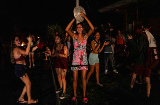 People protest asking for the restoration of electrical service after four days of blackout due to the devastation of Hurricane Ian in Bacuranao, Cuba, Friday, Sept. 30, 2022. (AP Photo/Ramon Espinosa)