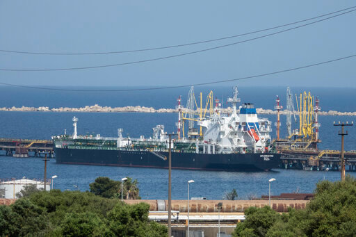 FILE - The San Sebastian oil tanker is moored at the docks of the ISAB refinery in Priolo-Gargallo near Syracuse, Sicily, May 31, 2022. The ISAB is owned by Russia's Lukoil. The U.S. and its allies are navigating questions as they plan to impose a price cap on Russian oil by December. (AP Photo/Gaetano Adriano Pulvirenti, File)
