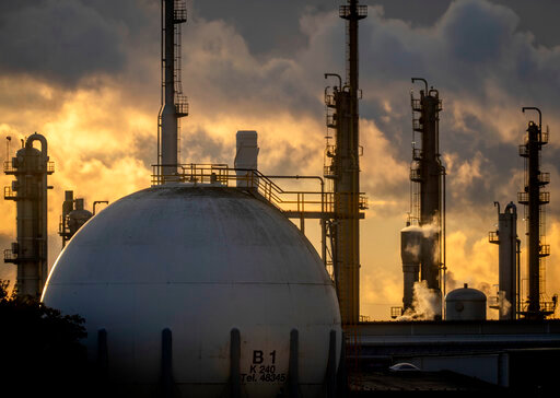 Chimneys and a tank are pictured at the BASF chemical plant in Ludwigshafen, Germany, Tuesday, Sept. 27, 2022. (AP Photo/Michael Probst)