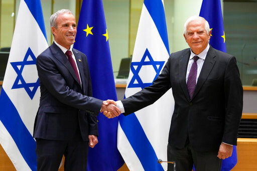 European Union foreign policy chief Josep Borrell, right, greets Israel's Minister of Intelligence Elazar Stern prior to a meeting of the EU-Israel Association Council at the EU Council building in Brussels on Monday, Oct. 3, 2022. (AP Photo/Virginia Mayo)