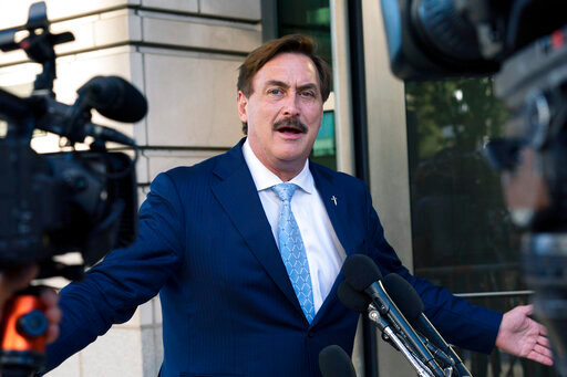 FILE - MyPillow chief executive Mike Lindell, speaks to reporters outside federal court in Washington, June 24, 2021. The Supreme Court says it won’t intervene in a lawsuit in which Dominion Voting Systems accused MyPillow chief executive Mike Lindell of defamation for falsely accusing the company of rigging the 2020 presidential election against former President Donald Trump. (AP Photo/Manuel Balce Ceneta, File)