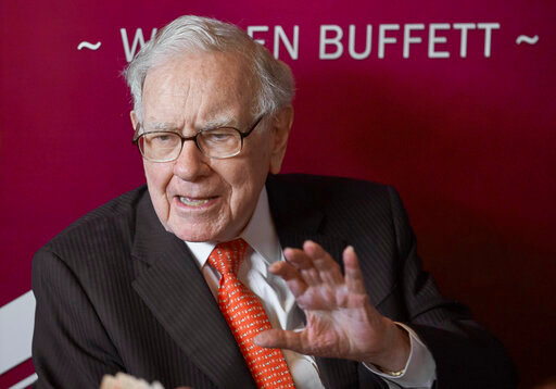 FILE - Warren Buffett, Chairman and CEO of Berkshire Hathaway, speaks during a game of bridge following the annual Berkshire Hathaway shareholders meeting on May 5, 2019, in Omaha, Neb. Buffett's successor, Berkshire Hathaway Vice Chairman Greg Able, bought nearly $70 million worth of stock in the conglomerate he is slated to one day lead after the legendary investor is gone, according to a filing with the Securities and Exchange Commission Monday, Oct. 3, 2022. (AP Photo/Nati Harnik, File)