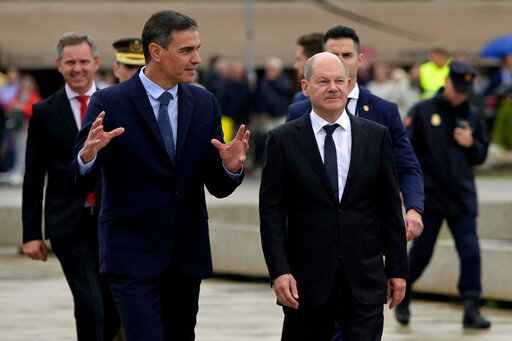 Spanish Prime Minister Pedro Sanchez, left, speaks alongside German Chancellor Olaf Scholz during a summit in A Coruna, Spain, Wednesday Oct. 5, 2022. Leaders of Spain and Germany are meeting in northwestern Spain for a one-day summit focusing on Europe's energy crisis and consequences of the Russian invasion of Ukraine. (M.Dylan/Europa Press via AP)