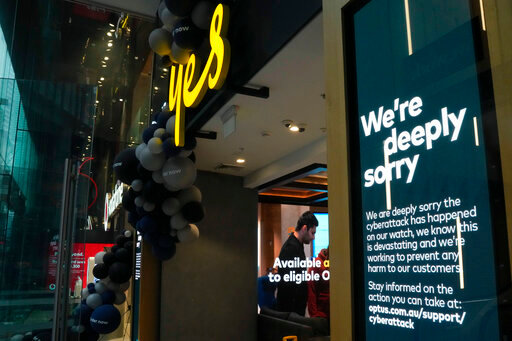Electronic signage at an Optus telecommunications retail store is seen at the central business district of Sydney, Australia, Wednesday, Oct. 5, 2022. The government has announced changes to telecommunications law, Thursday, Oct. 6 to protect customers of Australia's second-largest wireless carrier, Optus, whose personal details were stolen in a major cyberattack. (AP Photo/Mark Baker)