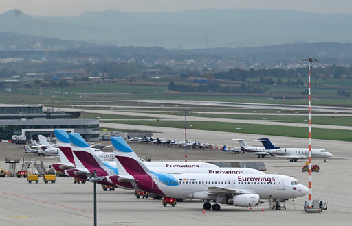 Eurowings aircrafts are parked at the airport in Stuttgart, Germany, Thursday, Oct. 6, 2022. A pilots strike at budget airline Eurowings has forced the German carrier to cancel hundreds of flights Thursday. The airline said about half of its 500 daily flights would be nixed, affecting tens of thousands of passengers in Germany and elsewhere in Europe. (Bernd Weissbrod/dpa via AP)