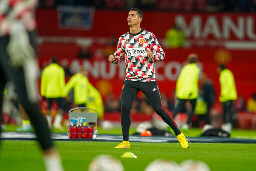 Manchester United's Cristiano Ronaldo warms up ahead of the English Premier League soccer match between Manchester United and Tottenham Hotspur at Old Trafford in Manchester, England, Wednesday, Oct. 19, 2022. (AP Photo/Dave Thompson)