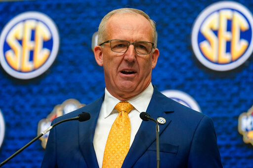 FILE - Southeastern Conference Commissioner Greg Sankey speaks during SEC Media Days, July 18, 2022, in Atlanta. The third in-person meeting of conference commissioners who manage the College Football Playoff since an August directive from their bosses to expand the postseason format ended without a resolution but not without optimism. “There's a will to try and that will is still there,” Sankey said Thursday, Oct. 20, 2022. (AP Photo/John Bazemore, File)
