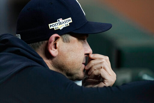 New York Yankees manager Aaron Boone watches play from the dugout during the ninth inning in Game 2 of baseball's American League Championship Series between the Houston Astros and the New York Yankees, Thursday, Oct. 20, 2022, in Houston. (AP Photo/Kevin M. Cox)
