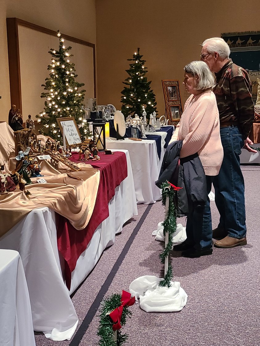 Linda Carman, left, and Darrell Carman look at the many different nativites on display at the Nativity Festival at the Church of Jesus Christ of Latter-day Saints on Saturday.