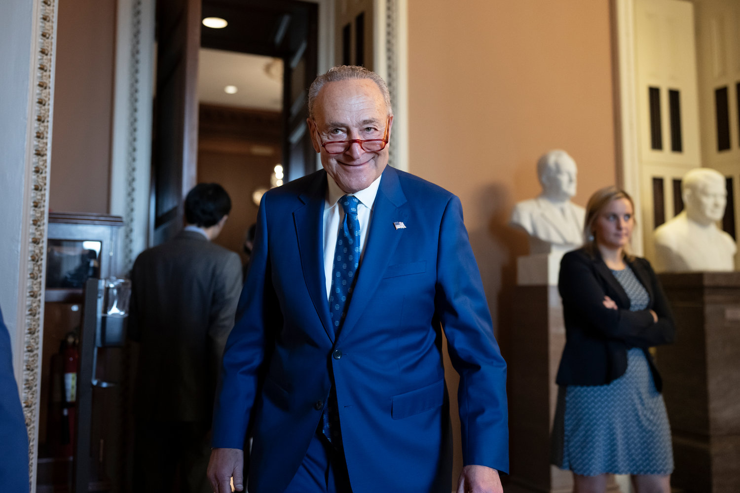 Senate Majority Leader Chuck Schumer, D-N.Y., grins as he emerges from the closed-door Senate Democratic Caucus leadership election at the Capitol in Washington, Thursday, Dec. 8, 2022. Sen. Schumer will remain as Senate Democratic leader and chair of the Democratic Conference in the new Congress beginning Jan. 3, 2023.
