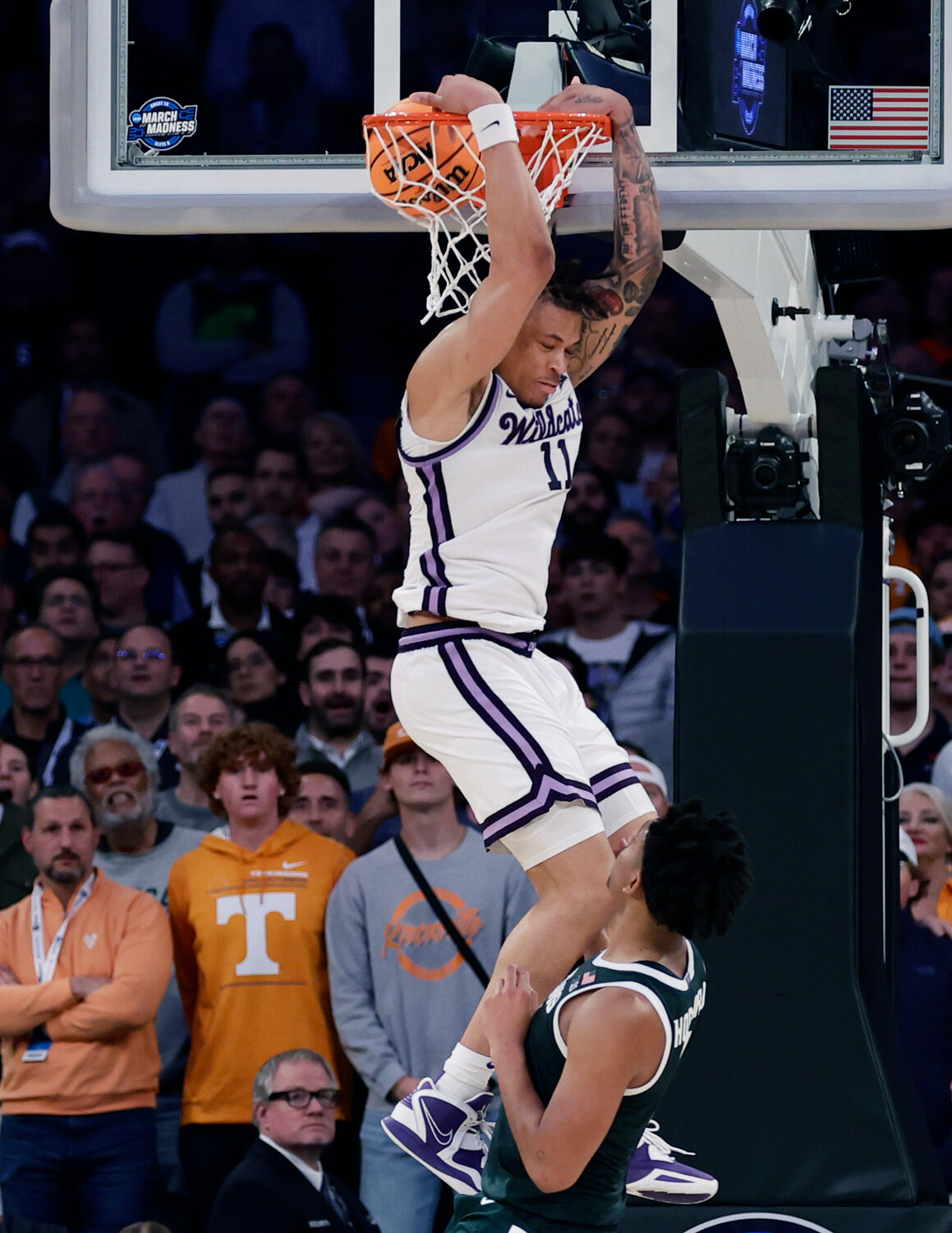 Kansas State forward Keyontae Johnson (11) dunks in overtime of a Sweet 16 game against Michigan State in the East Regional on March 23 at Madison Square Garden in New York. (AP Photo/Adam Hunger)