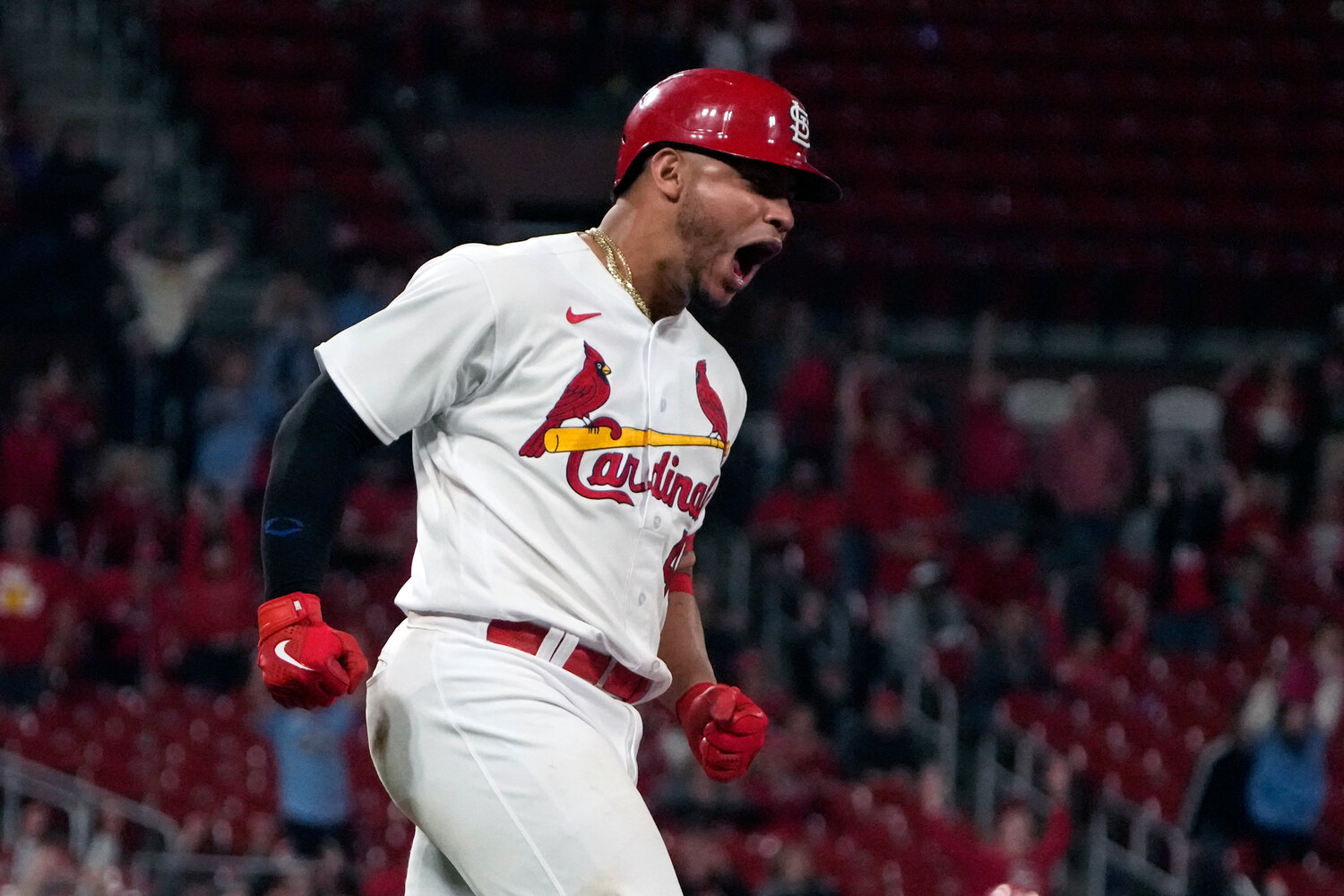 St. Louis Cardinals' Willson Contreras celebrates after hitting a two-run home run during the ninth inning of a baseball game against the Arizona Diamondbacks Tuesday, April 18, 2023, in St. Louis. (AP Photo/Jeff Roberson)