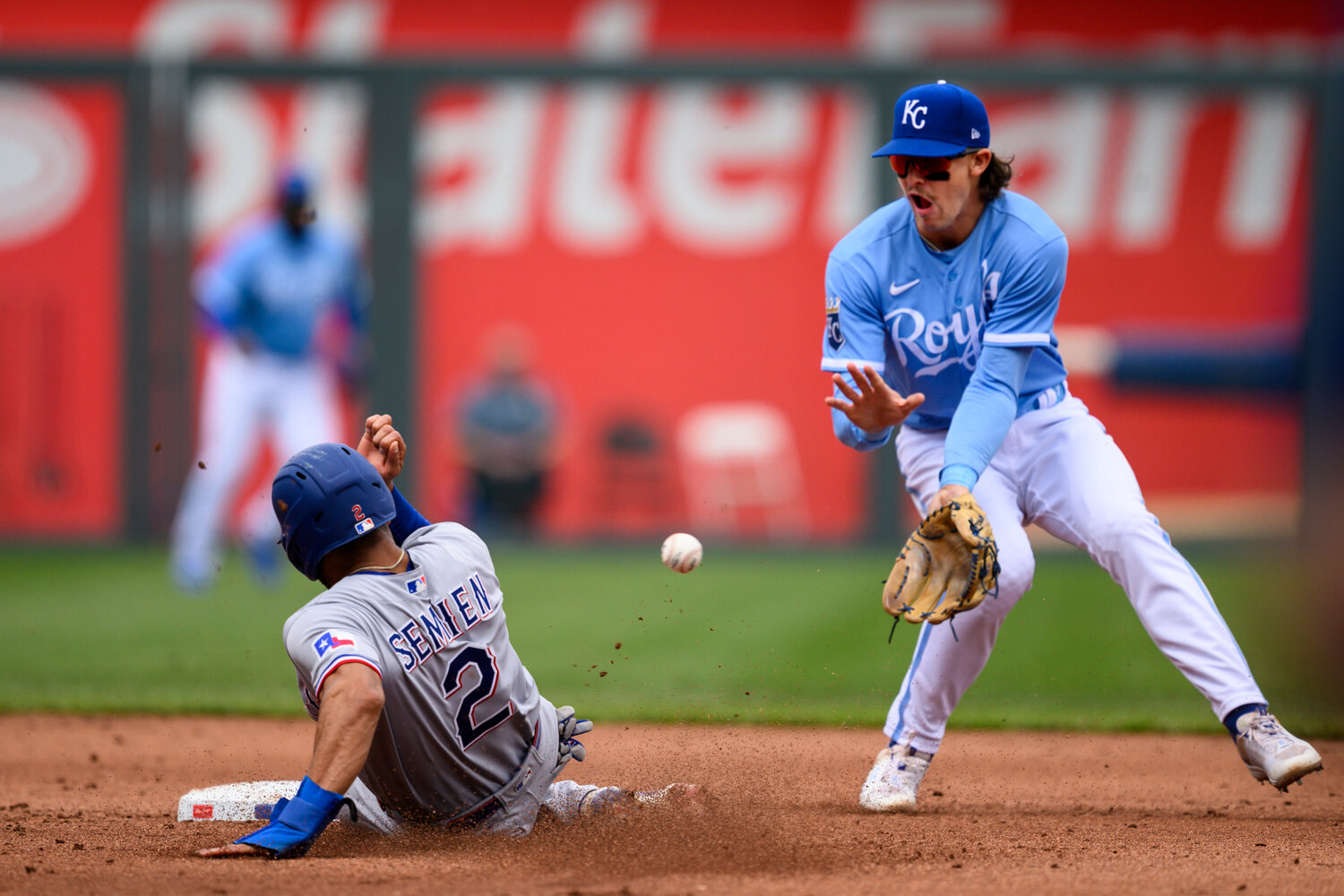 Texas Rangers' Marcus Semien (2) steals second safely ahead of the throw to Kansas City Royals shortstop Bobby Witt Jr. during the second inning of Wednesday's game in Kansas City, Mo. (AP Photo/Reed Hoffmann)