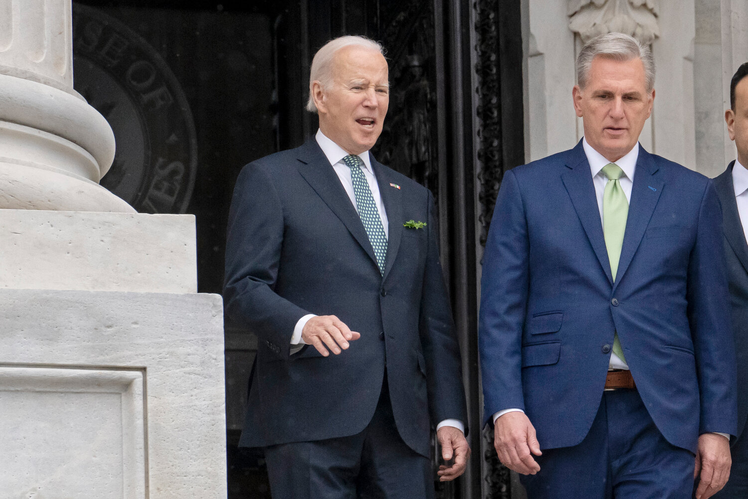 FILE - President Joe Biden talks with House Speaker Kevin McCarthy, R-Calif., as he departs the Capitol following the annual St. Patrick's Day gathering, in Washington, March 17, 2023. Facing the risk of a federal government default as soon as June 1, President Joe Biden has invited the top four congressional leaders to a White House meeting on May 9 for talks. Itâs the first concrete step toward negotiations on averting a potential economic catastrophe, but thereâs a long way to go: Biden and Republicans canât even agree on whatâs up for negotiation.  (AP Photo/J. Scott Applewhite, File)
