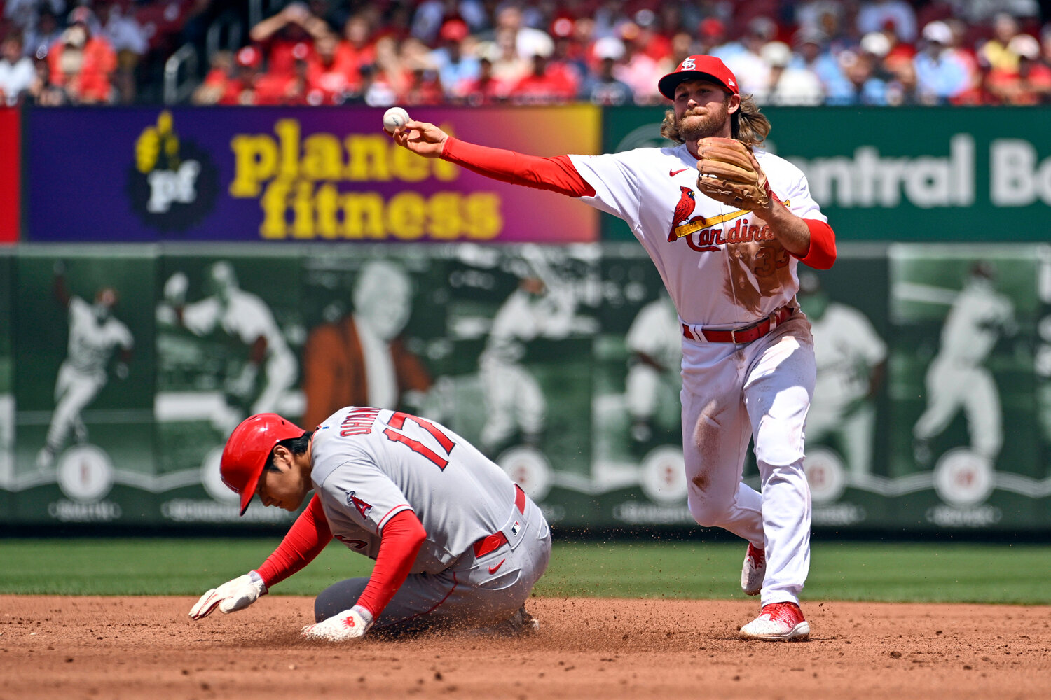 Los Angeles Angels' Shohei Ohtani is forced out at second as St. Louis second baseman Brendan Donovan turns a double play in the third inning of their game, Thursday in St. Louis. (AP Photo/Joe Puetz)