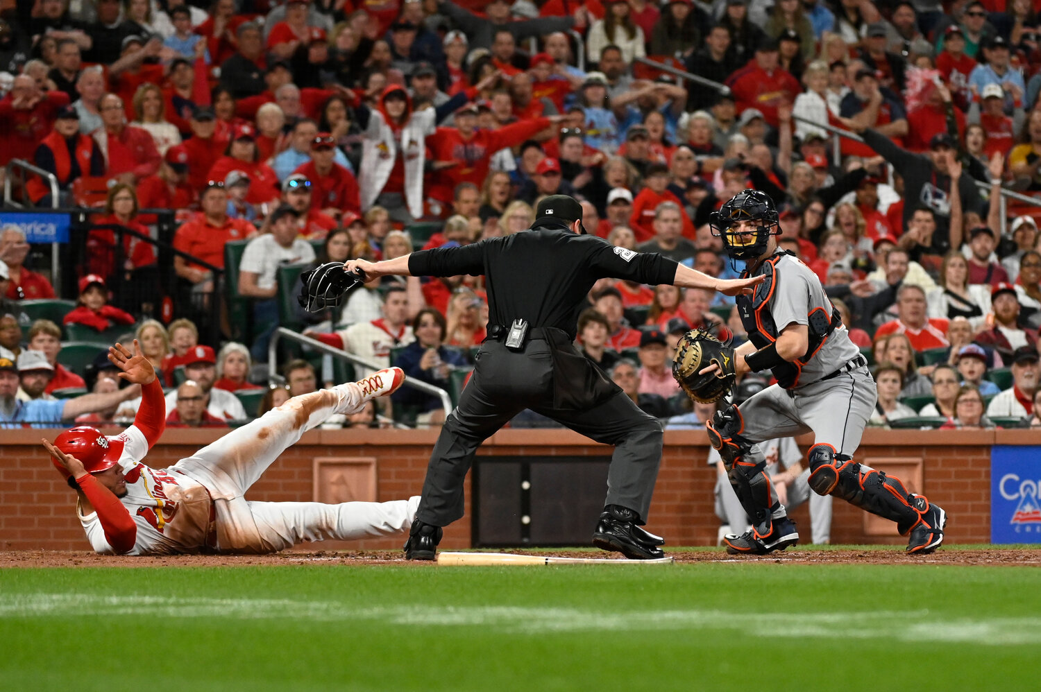St. Louis Cardinals' Willson Contreras (left) is safe at home plate as Detroit Tigers catcher Jake Rogers looks on during the fourth inning of their game Friday night in St. Louis. (AP Photo/Jeff Le)