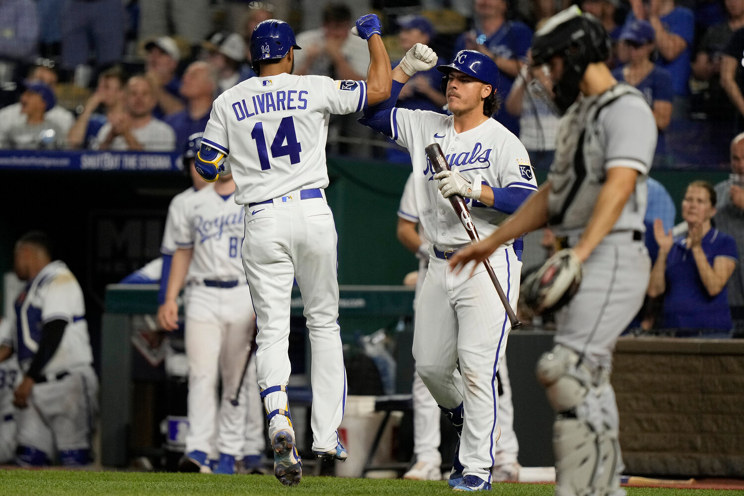 Kansas City Royals' Edward Olivares (14) celebrates with Nick Pratto after hitting a home run during the seventh inning of their game against the Chicago White Sox on Wednesday in Kansas City, Mo. (AP Photo/Charlie Riedel)