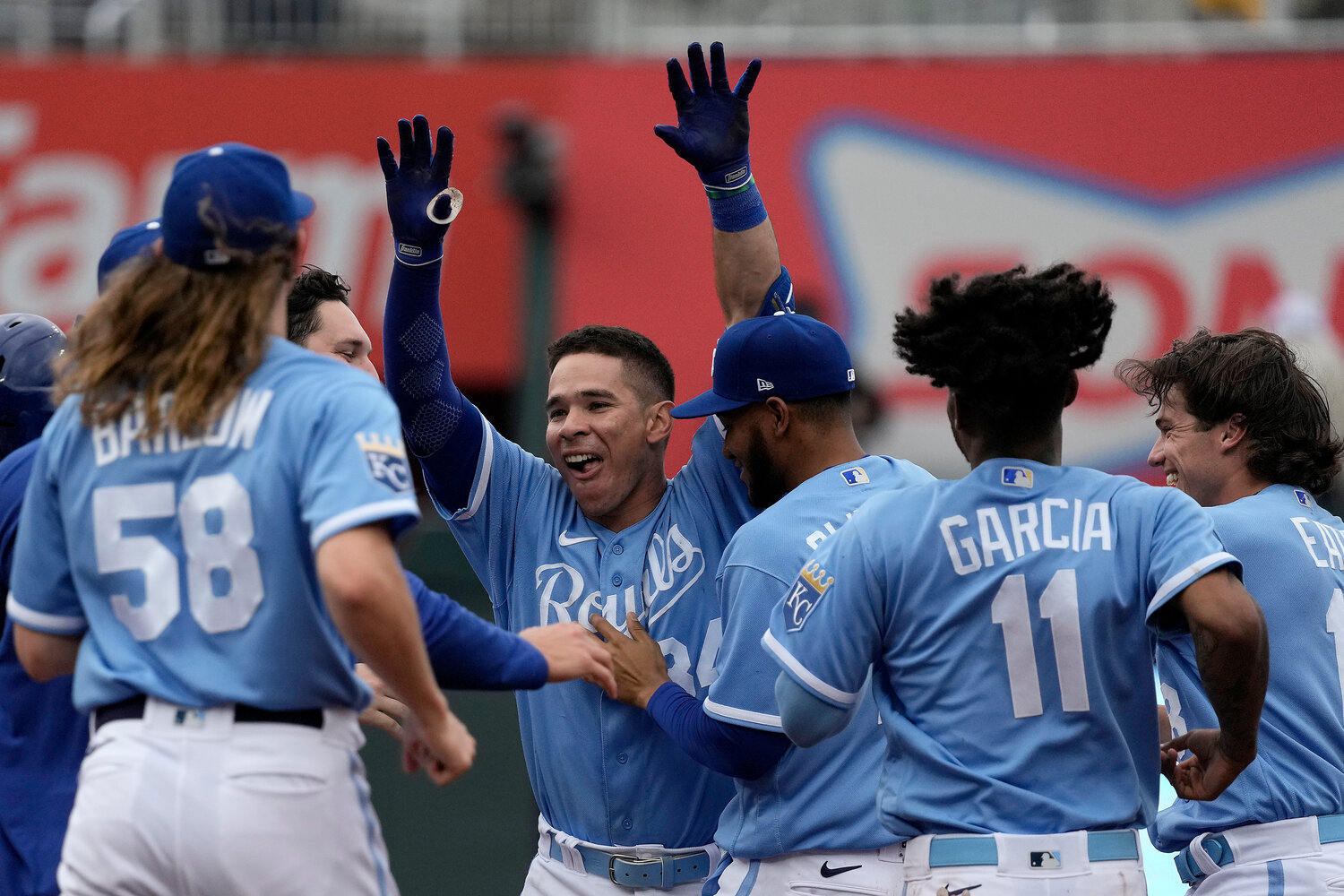 Kansas City Royals' Freddy Fermin (center) celebrates with teammates after their 4-3 victory over the Chicago White Sox on Thursday in Kansas City, Mo. (AP Photo/Charlie Riedel)