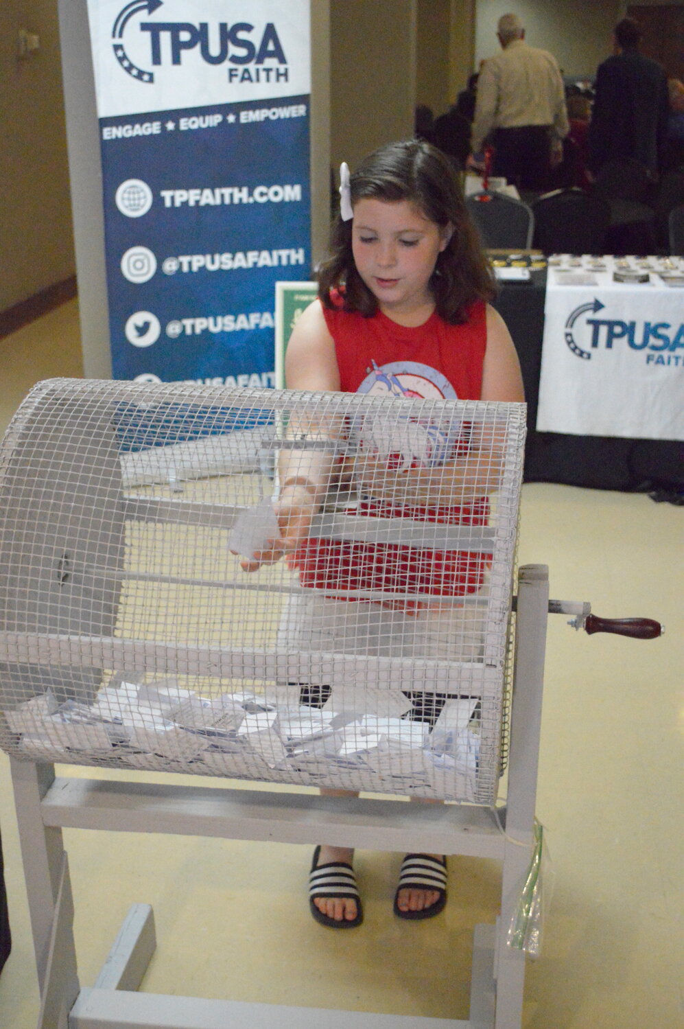 Kaitlin Cochran, daughter of Crawford County Republican Party chairman Jacob Cochran, helped out at the Dinner and Discussion event Saturday, May 20 by putting names into the raffle.