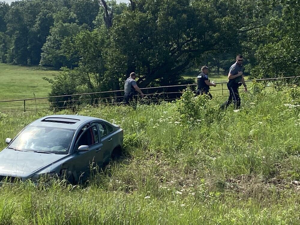 Law enforcement officers search an area south of Highway 166 east of Baxter Springs after pursuing Hunter Hayes-Bebee, 24, of Galena. After the vehicle he was driving went off the roadway, he fled on foot but was later apprehended.
