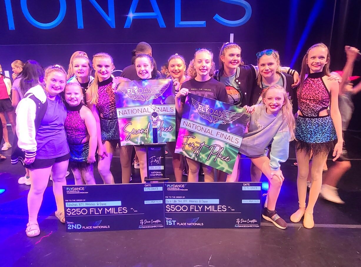 Dancers from BTC Athletics and Dance’s BTC F.O.R.C.E. competition team stand with their first and second place prizes at the Fly Dance Competition Nationals in St. Louis, Missouri.