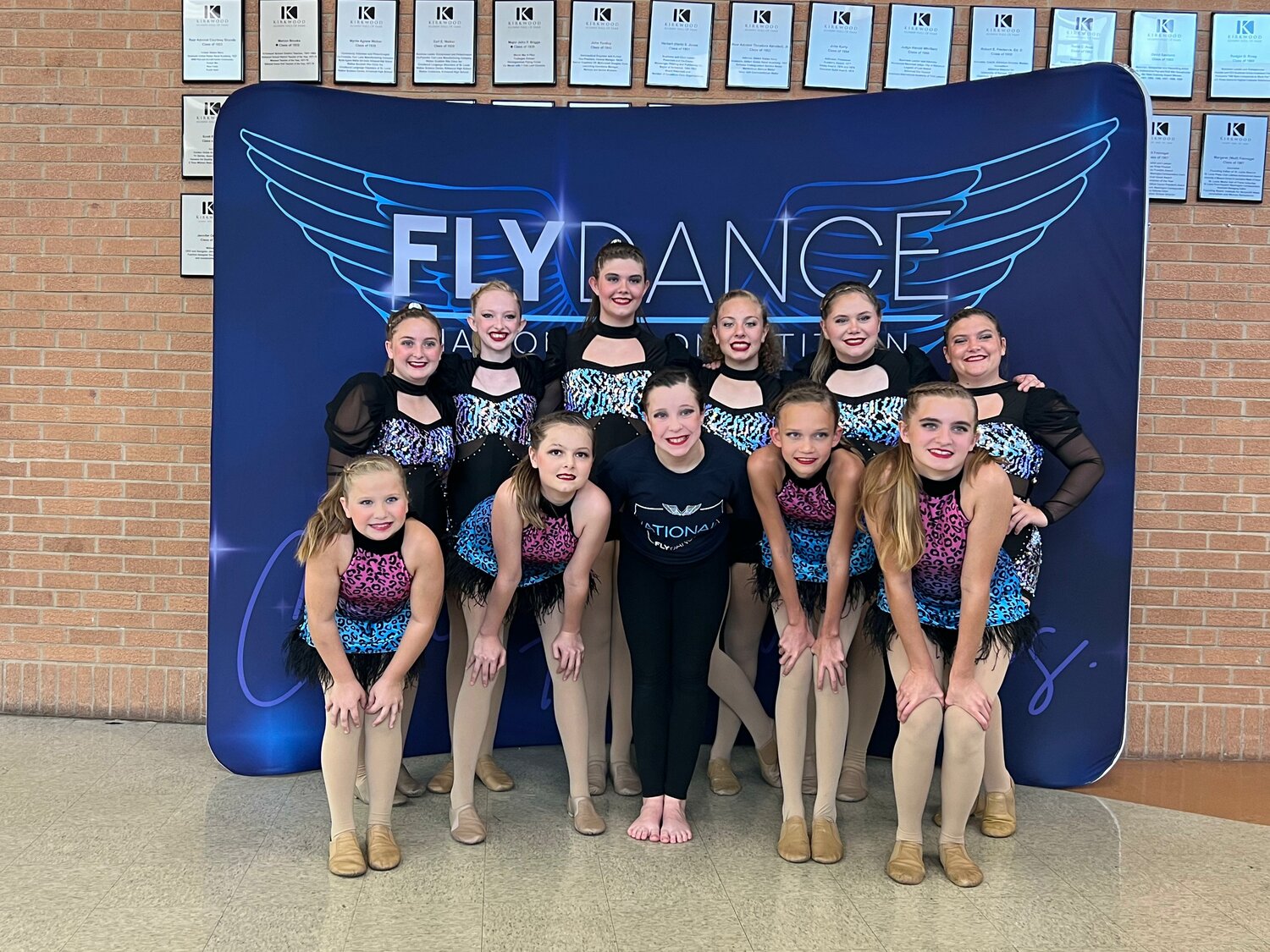 The 11 members of the BTC F.O.R.C.E. competition team pose for a photo at at the Fly Dance Competition Nationals in St. Louis, Missouri.